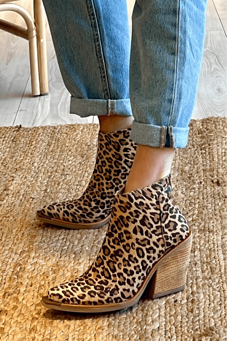 Side profile of women's brown pointed cowboy boots highlighting the sleek silhouette