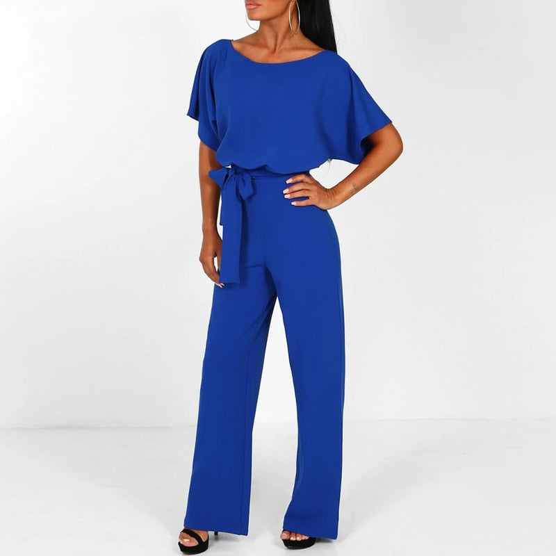 Full-length side view of a wide-leg jumpsuit highlighting the graceful silhouette and elongating leg design