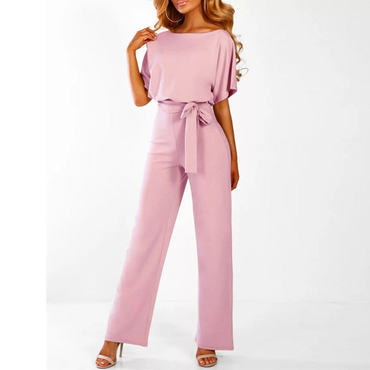 Detail shot of the adjustable belt on a wide-leg jumpsuit cinching the natural waist for a flattering fit