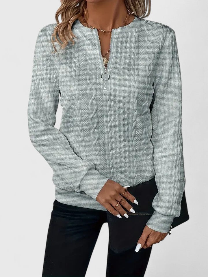 Side profile of the Elise sophisticated sweater in black, showing its elegant tailored fit