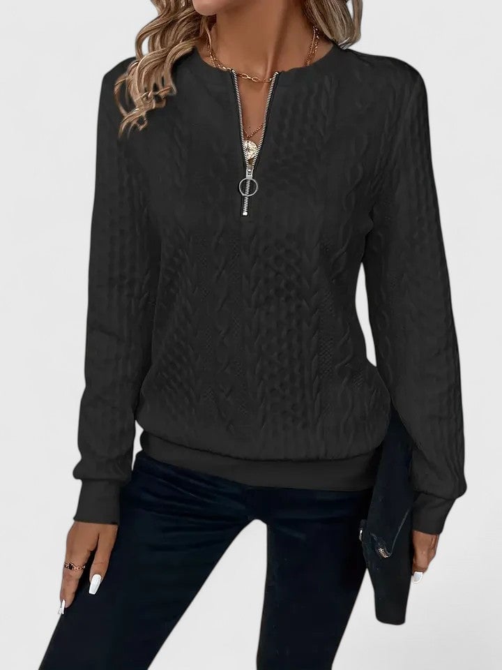 Flat lay of the Elise sophisticated sweater in white on a neutral background