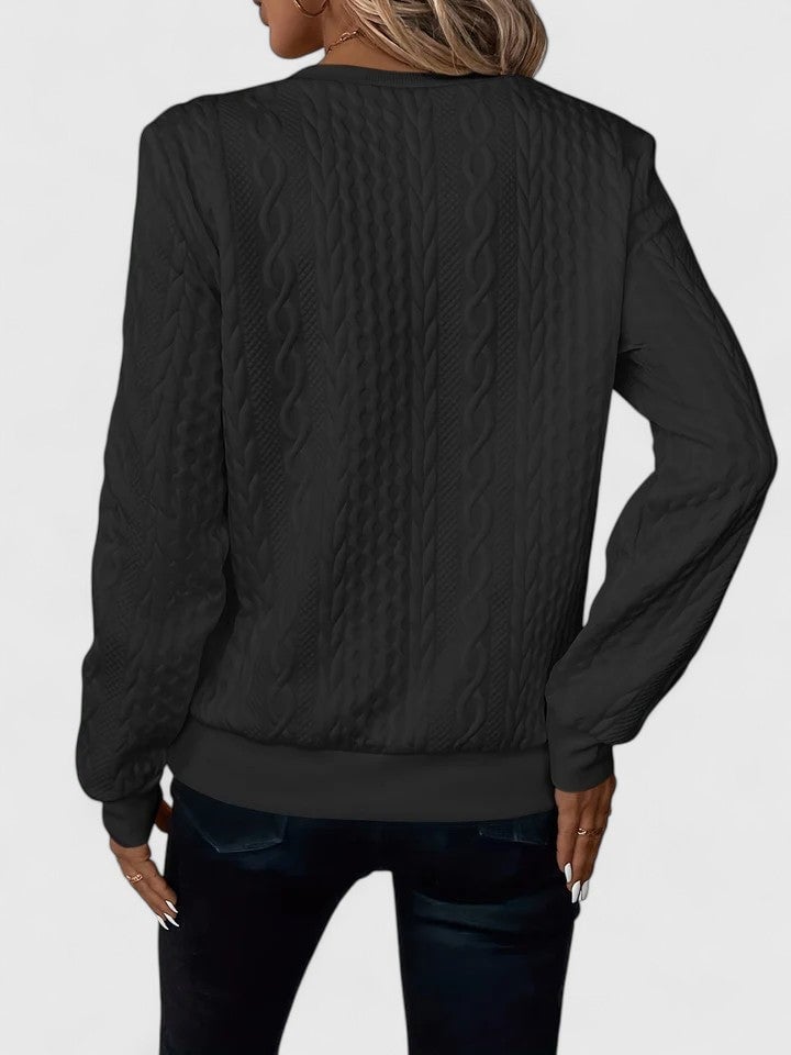 Detail shot of the Elise sophisticated sweater fabric texture in gray