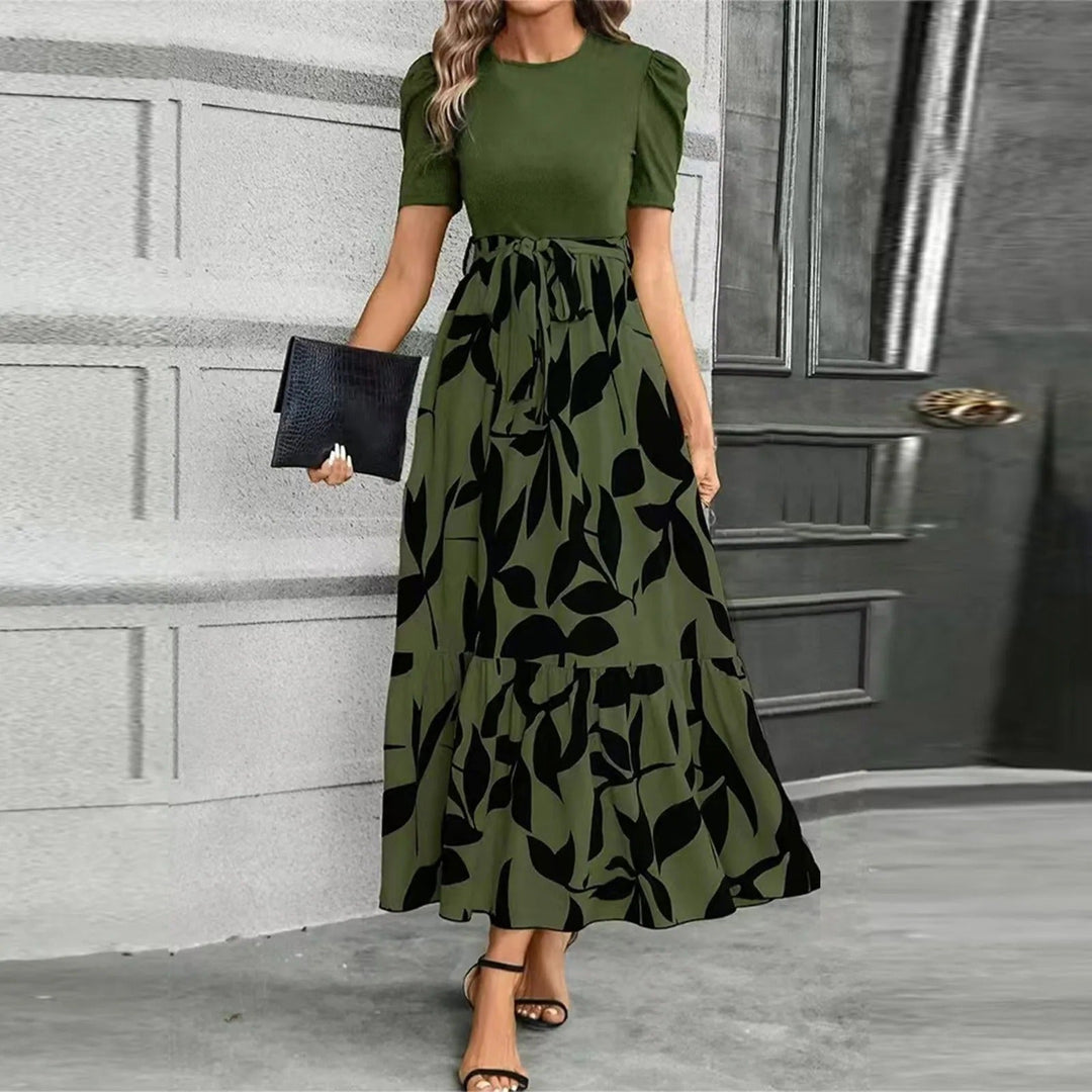 Woman wearing the Elise maxi dress in Fern Print Black, full-length side profile showing silhouette and ruffle hem