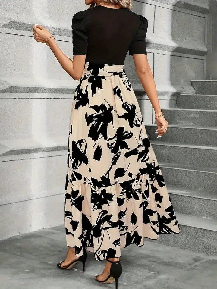 Detail shot of the self-tie bow waist on the Elise floral maxi dress in Monochrome Abstract Black
