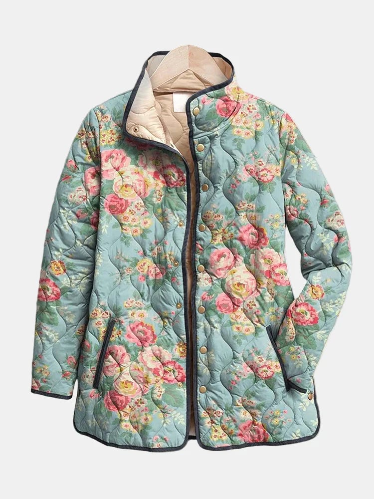 Model wearing a multicolor quilted floral print jacket with a relaxed fit and delicate all-over floral pattern