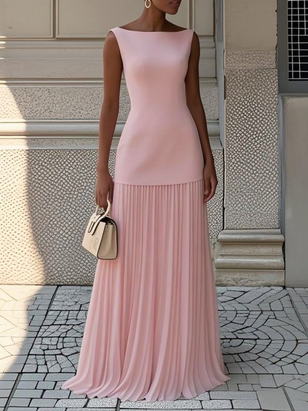 Close-up of the flowing pleated skirt detail on the Eliza sleeveless maxi dress