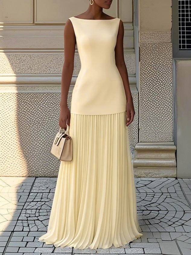 Full-length view of the Eliza sleeveless pleated maxi dress styled for an evening occasion