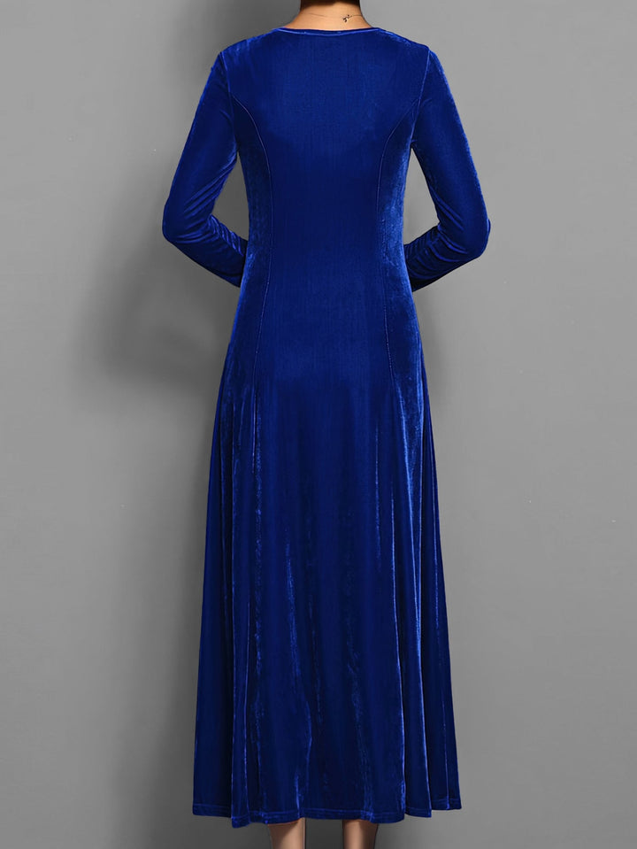 Close-up of the soft velvet fabric texture and A-line silhouette on the Elizabeth dress in blue