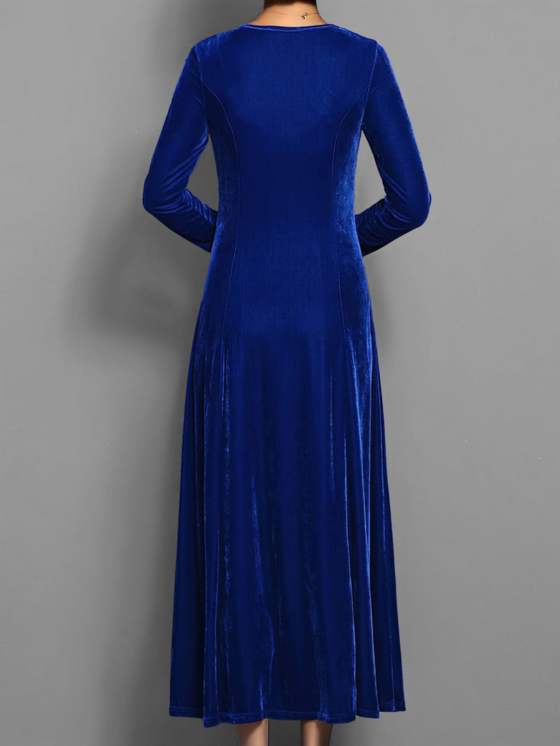 Close-up of the soft velvet fabric texture and A-line silhouette on the Elizabeth dress in blue