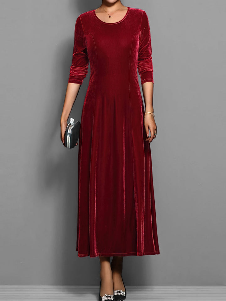 Front view of the Elizabeth velvet dress showing the fitted bodice and flowing A-line skirt