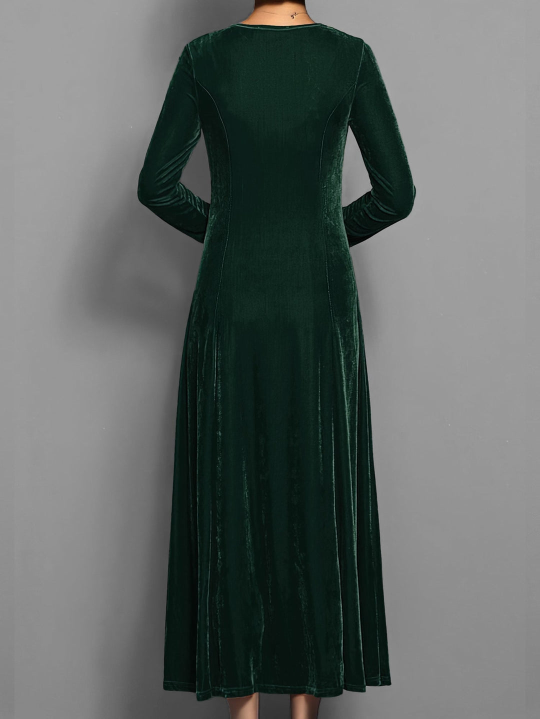 Model styling the Elizabeth velvet dress with heels at an evening event