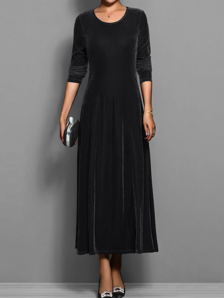 Elizabeth soft velvet dress in purple showing the rich color and graceful movement