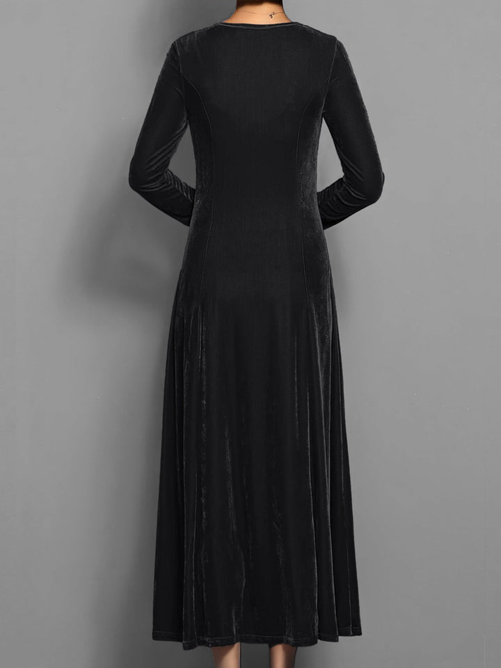 Flat lay of the Elizabeth soft velvet A-line dress in black showing overall silhouette and length