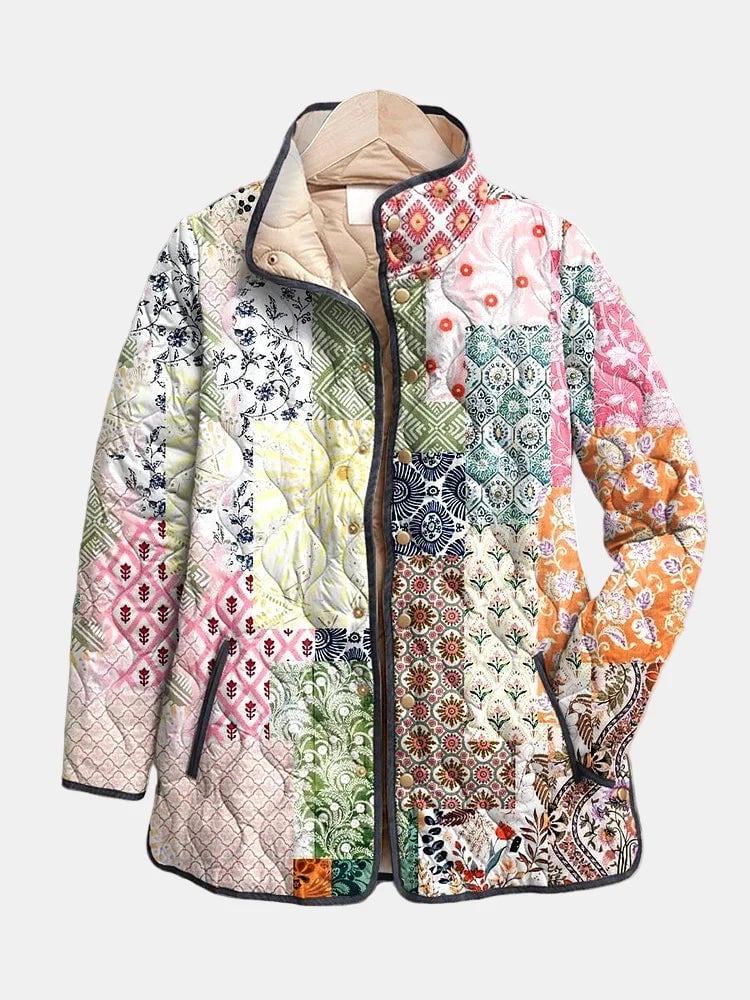 Woman wearing a lightweight quilted casual jacket with a delicate multicolor floral print, relaxed fit, available in sizes S to 3XL