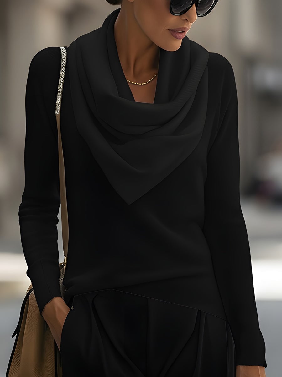 Front view of the draped cowl neck top in black showing elegant neckline drape