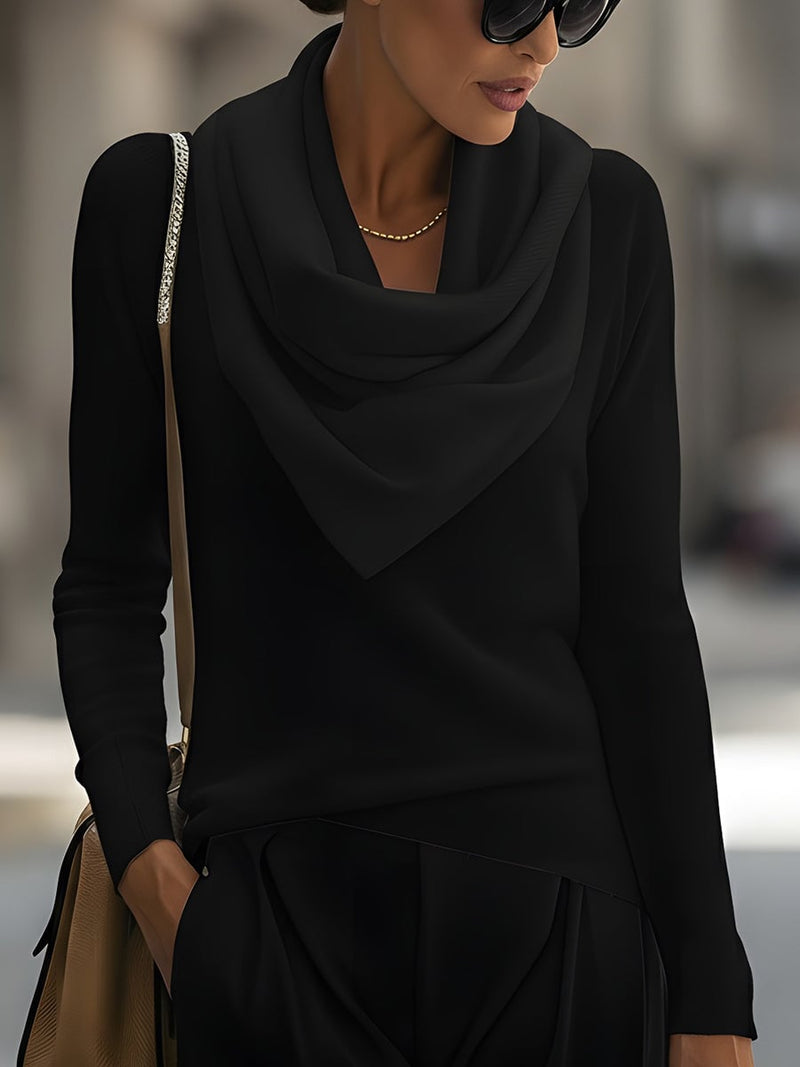 Front view of the draped cowl neck top in black showing elegant neckline drape