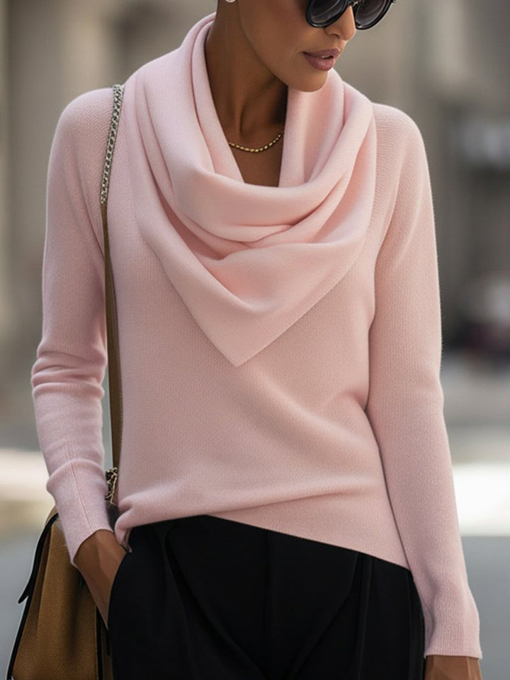 Close-up of the softly folded cowl neckline detail on a long-sleeve top in pink