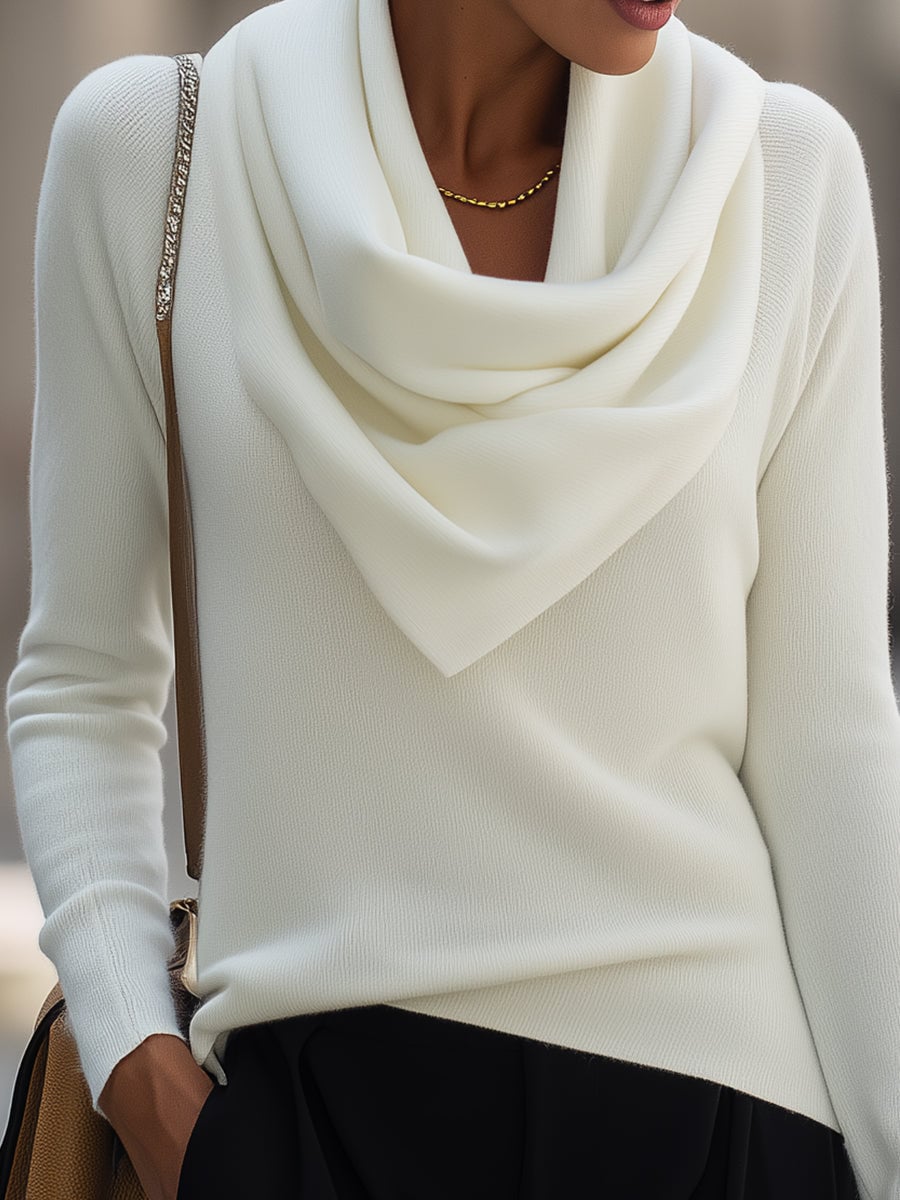 Full-length shot of a model wearing the draped cowl neck long-sleeve top in white