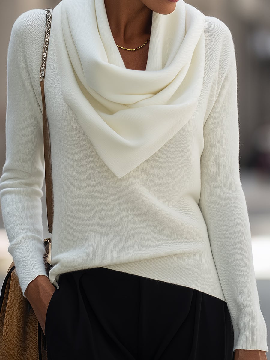 Detail shot of the draped cowl neckline on a long-sleeve top in black