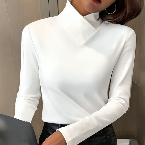 Woman wearing a soft turtleneck pullover in a classic high-neck style, styled for an elegant everyday look