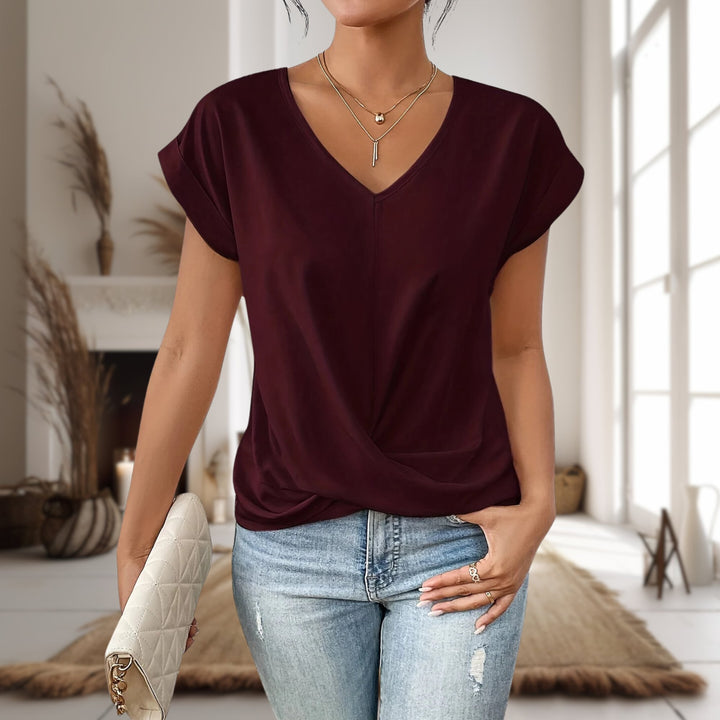 Woman wearing a burgundy red casual sweetheart neck t-shirt with a flattering neckline and relaxed fit