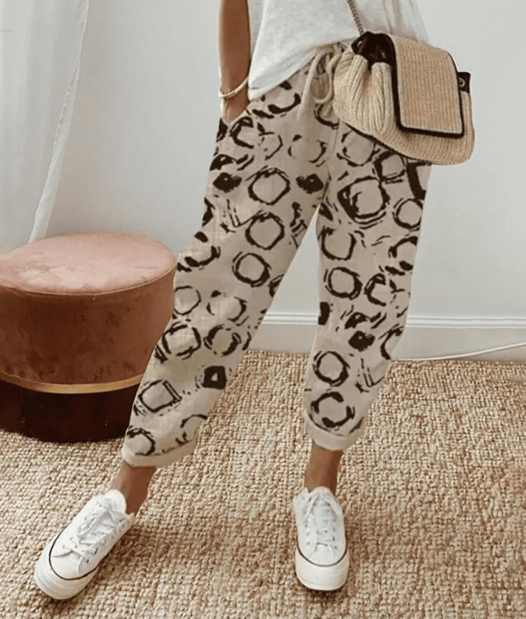 Close-up of breathable floral print trousers showing the smooth waistband and relaxed drape of the fabric