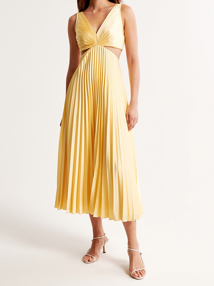 Side profile of a woman in a lightweight yellow maxi dress highlighting the smooth, flowing fabric drape