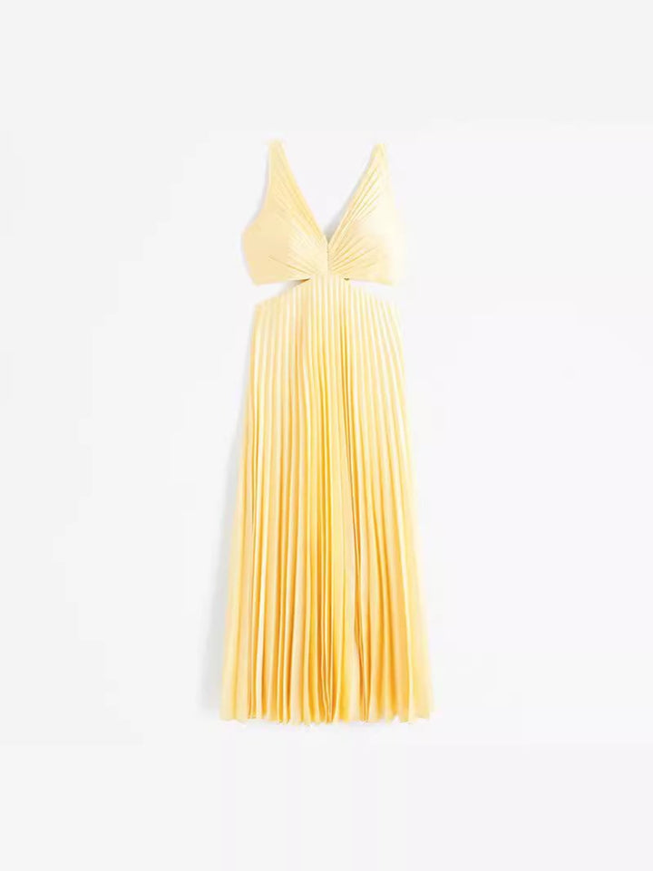 Woman in yellow Elle maxi dress styled with heeled sandals for an evening event