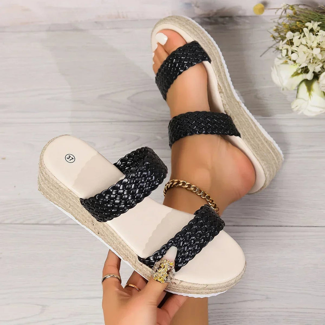 Elle woven platform flat sandals in black, rear view showing heel and platform base