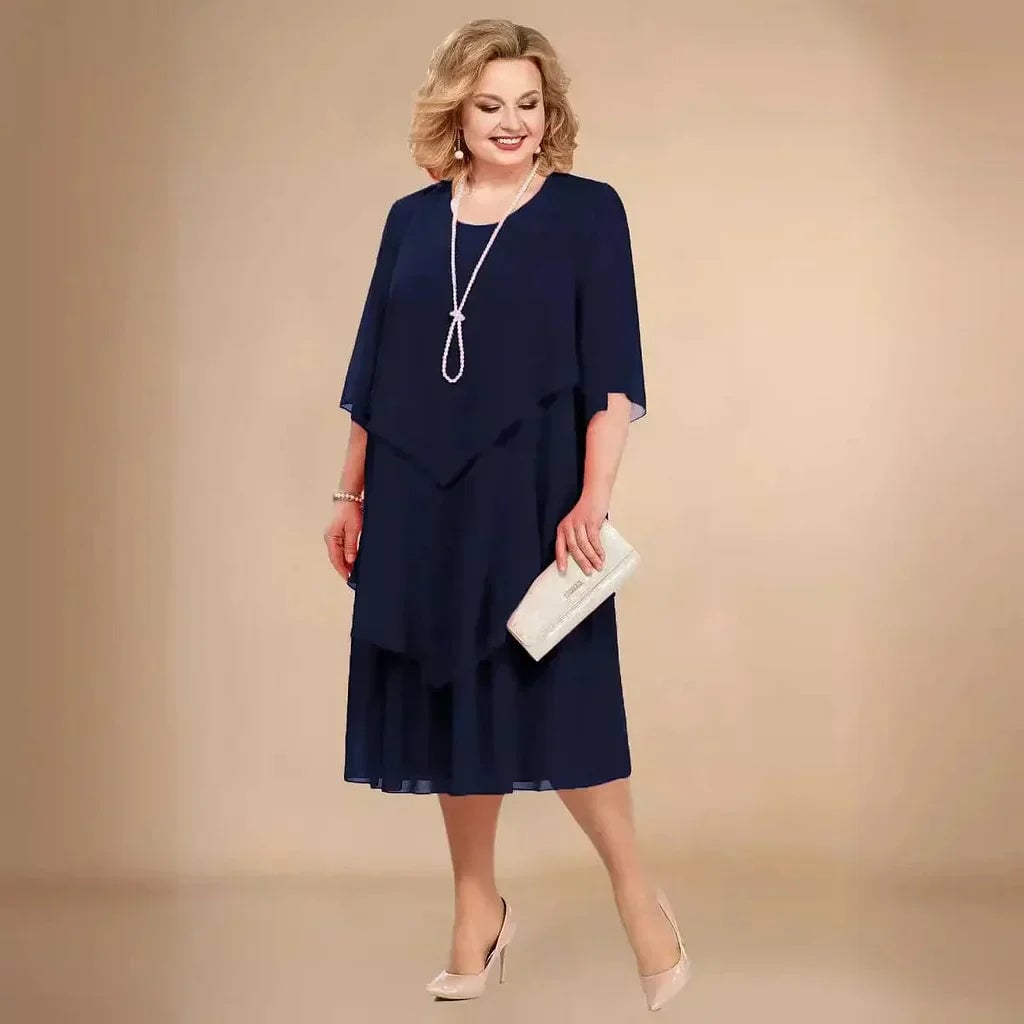 Close-up of soft chiffon fabric and layered overlay detail on the Ellen elegant dress
