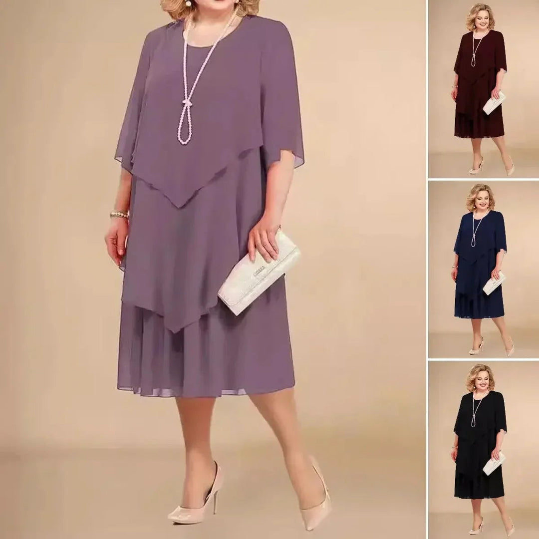 Side profile view of the Ellen chiffon dress showing the flowing asymmetrical silhouette and breathable fabric