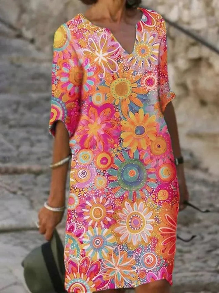 Side view of the Ellery floral dress in green showing the flowing fabric and flattering feminine fit