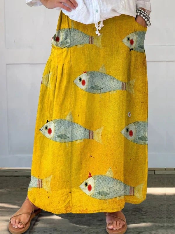 Yellow vintage fish art print A-line pocket skirt with elastic waistband, shown in full length front view