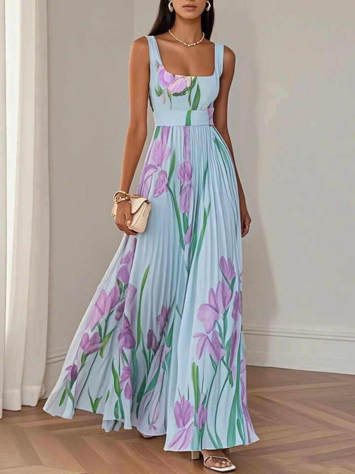 Model wearing white Ellie pleated chiffon maxi dress in an outdoor setting