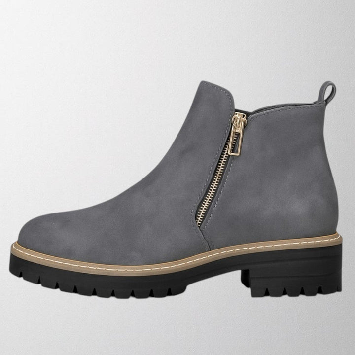 Side profile of the Elma round-toe side-zip shoe highlighting the clean, streamlined silhouette
