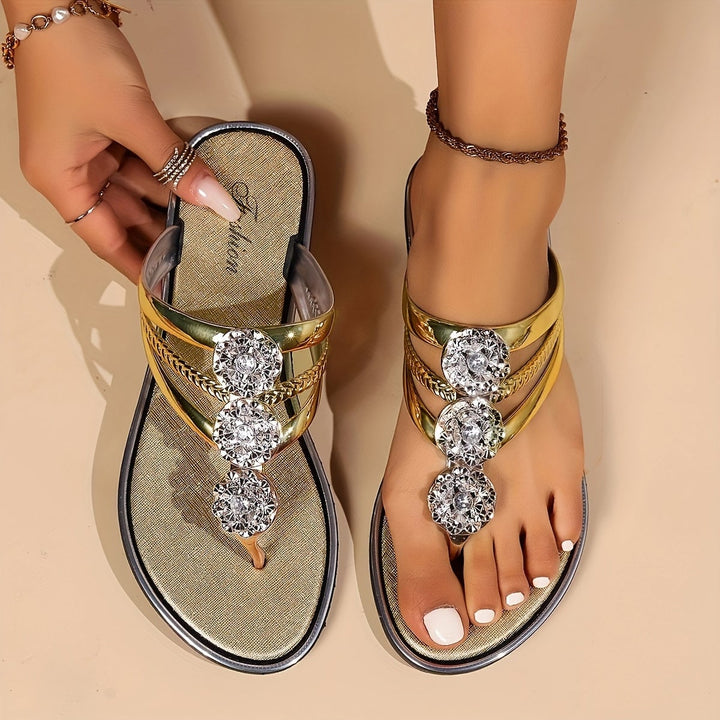 Eloira glam sandals in black with rhinestone accents styled on a model