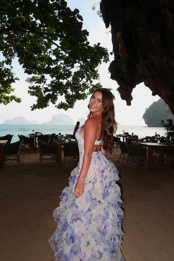 Model styling the Eloise floral maxi dress with heeled sandals for a wedding guest look
