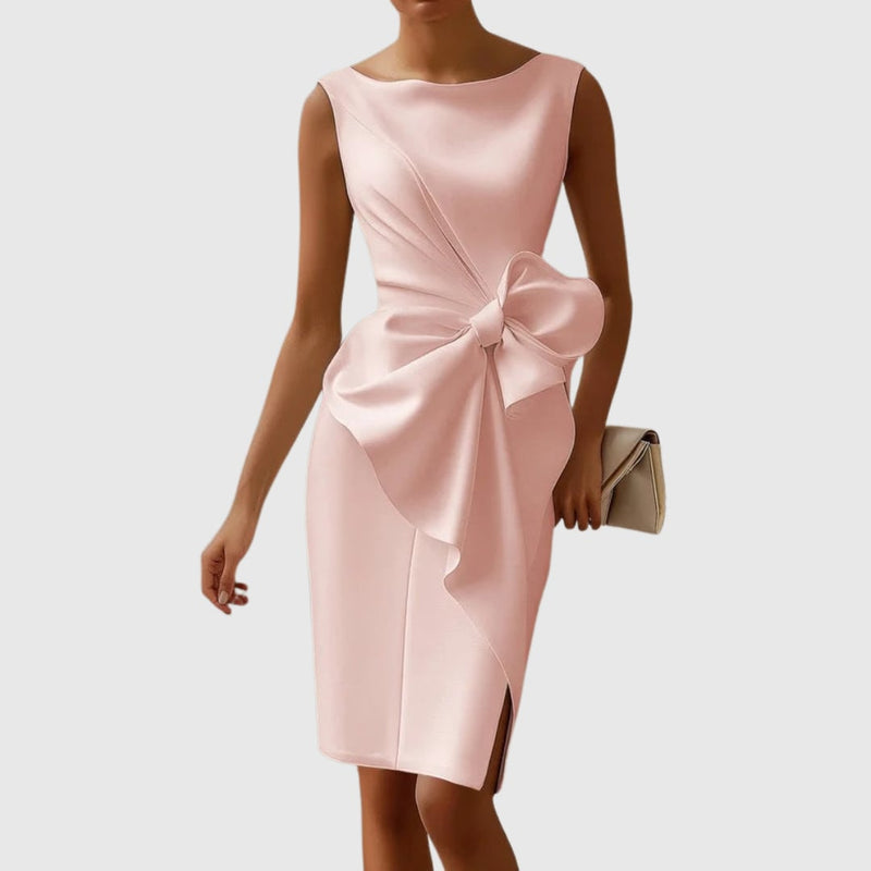 Side view of the Eloise midi dress highlighting the oversized three-dimensional bow detail and asymmetric drape