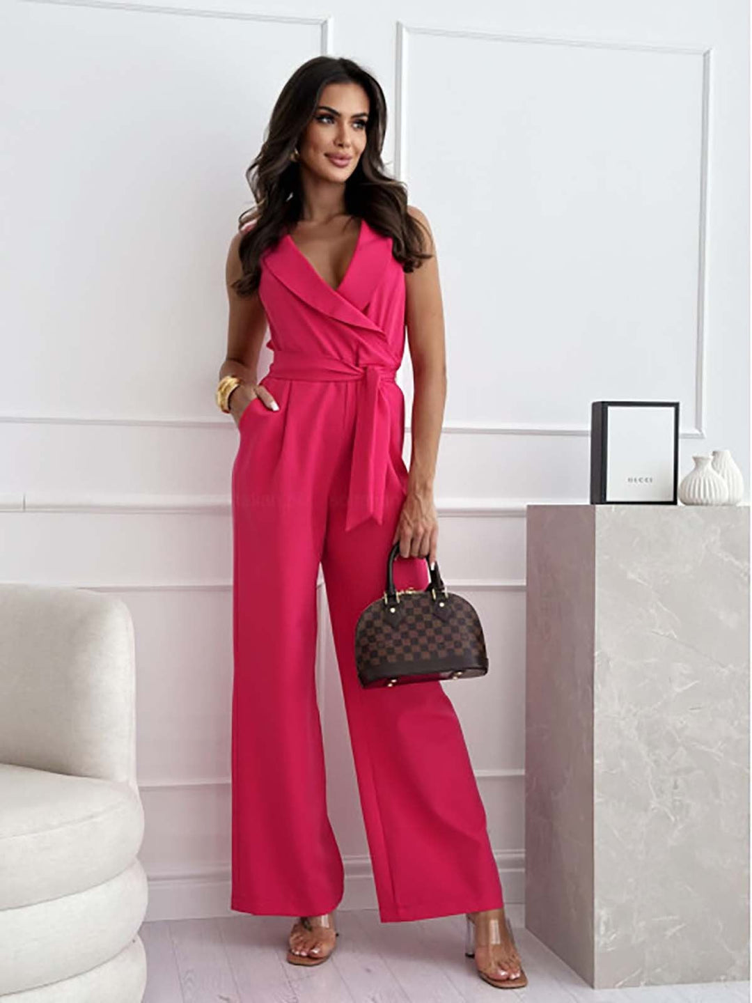Flat lay of the Eloise wide-leg wrap jumpsuit in all four colors: white, black, khaki, and pink