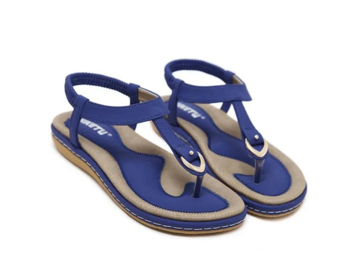 Lifestyle shot of Elowen orthopedic flat sandals worn with a casual summer outfit
