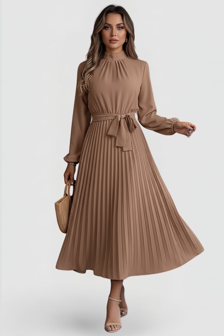 Model wearing Elowen pleated midi dress in Burgundy showing midi length