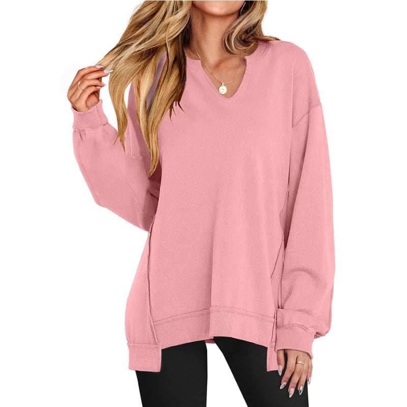 Front view of the Ember oversized tunic sweatshirt in light gray showing V-neckline and hip-length hem