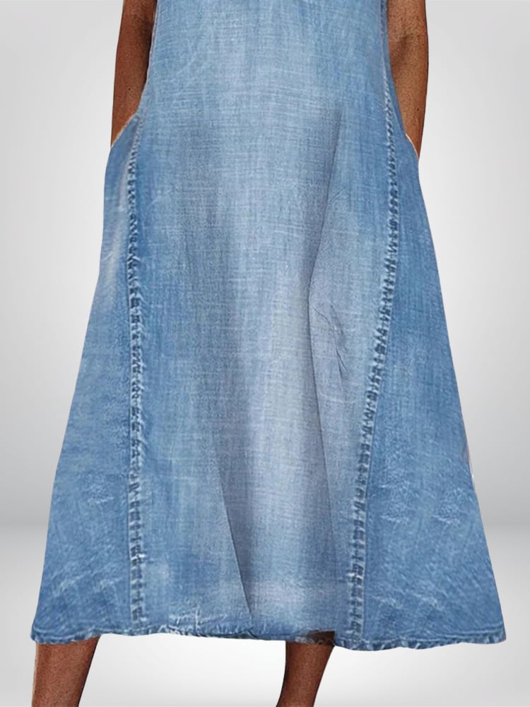 Close-up detail of the Emerson denim flowy dress fabric and silhouette highlighting its soft, breathable construction