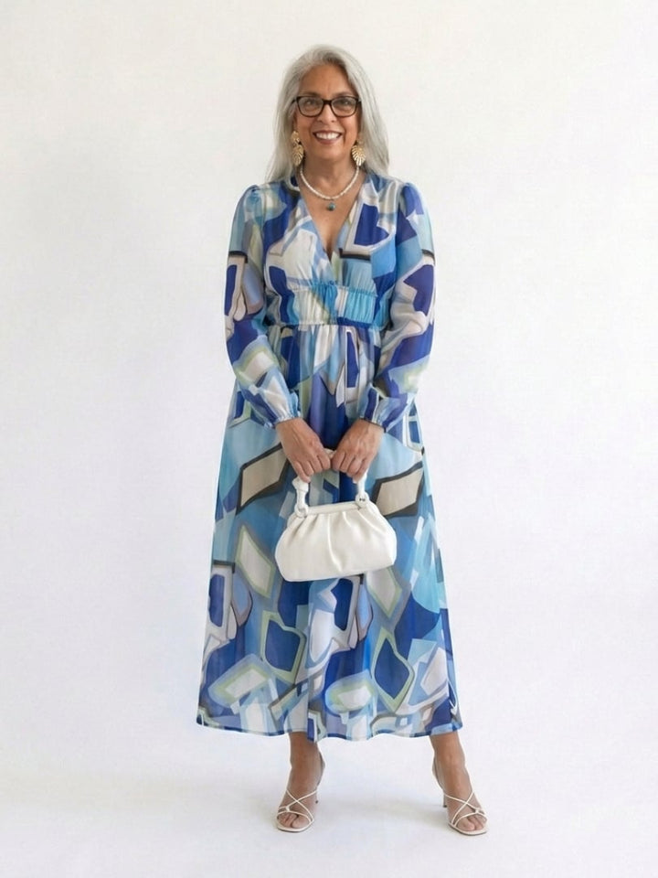 Detail shot of the long sleeves on the Emilia floral maxi dress in blue