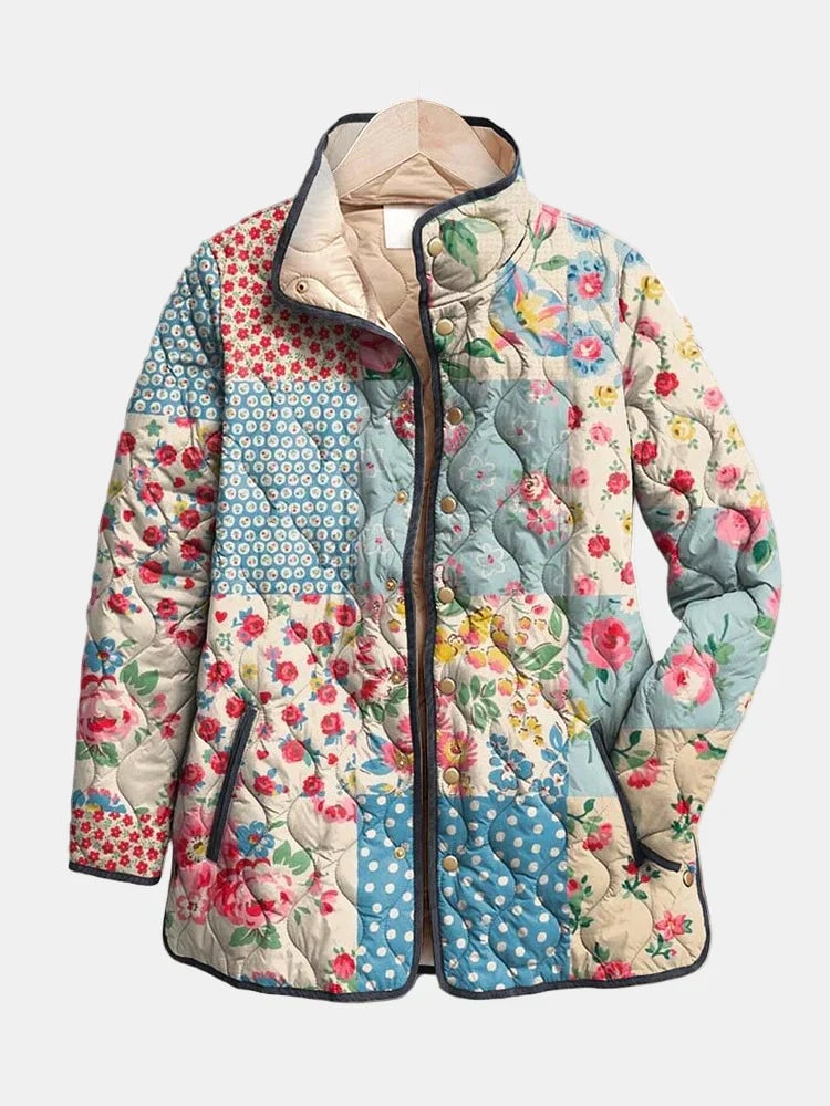 Woman wearing a charming multicolor floral quilted jacket with a relaxed fit, showcasing delicate floral print and lightweight insulated design