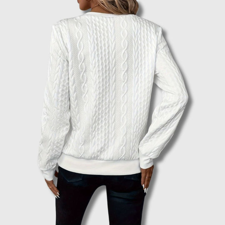 Emily elegant sweater in gray displayed on a model showing flattering fit and relaxed silhouette
