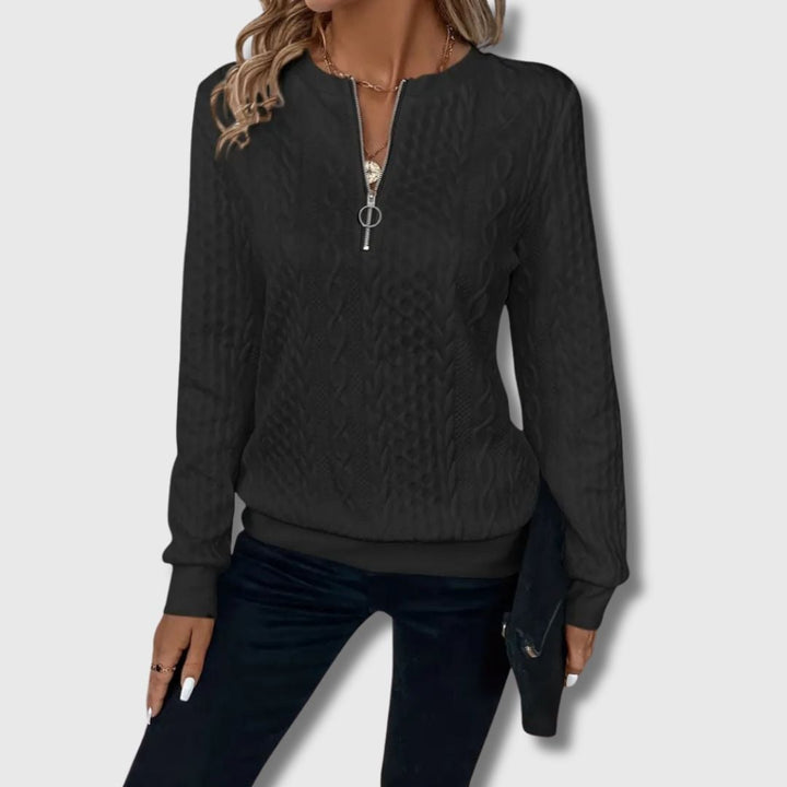 Emily elegant sweater in black worn as a versatile layering piece for a sophisticated look