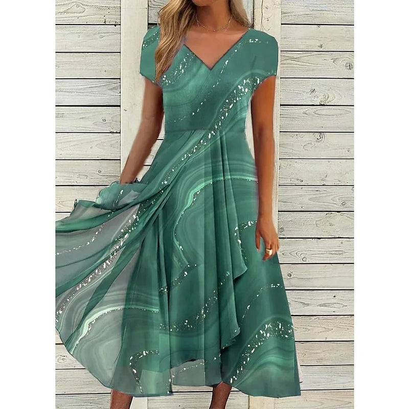Full-length view of a woman in a green V-neck midi dress showing the flattering flowing hem