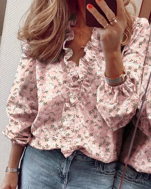 Side profile view of woman in a soft feminine blouse highlighting the graceful balloon sleeve silhouette