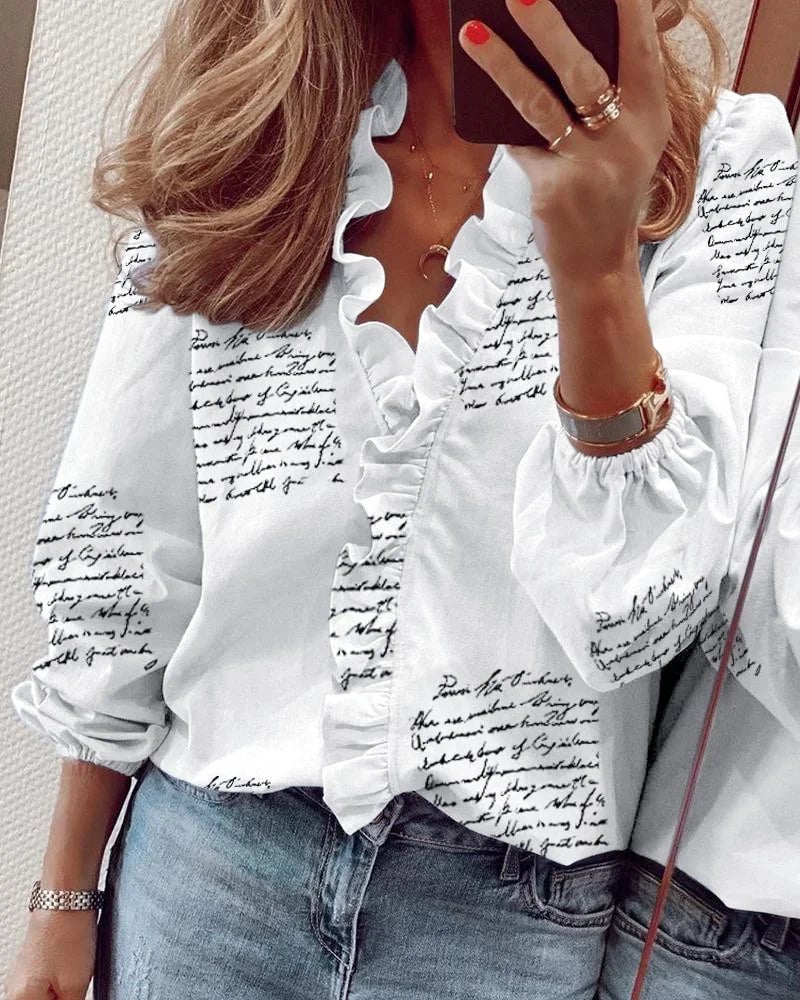 Ruffle blouse in pink displayed to show neckline detail and airy fabric drape
